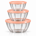 Three clear ribbed glass bowls with matching peach-colour lids, arranged by size on white background